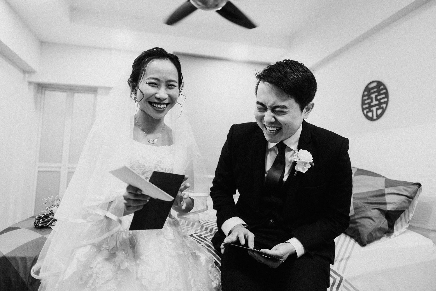 A series of photograph frames showing candid moments from an elegant black and white wedding celebration.