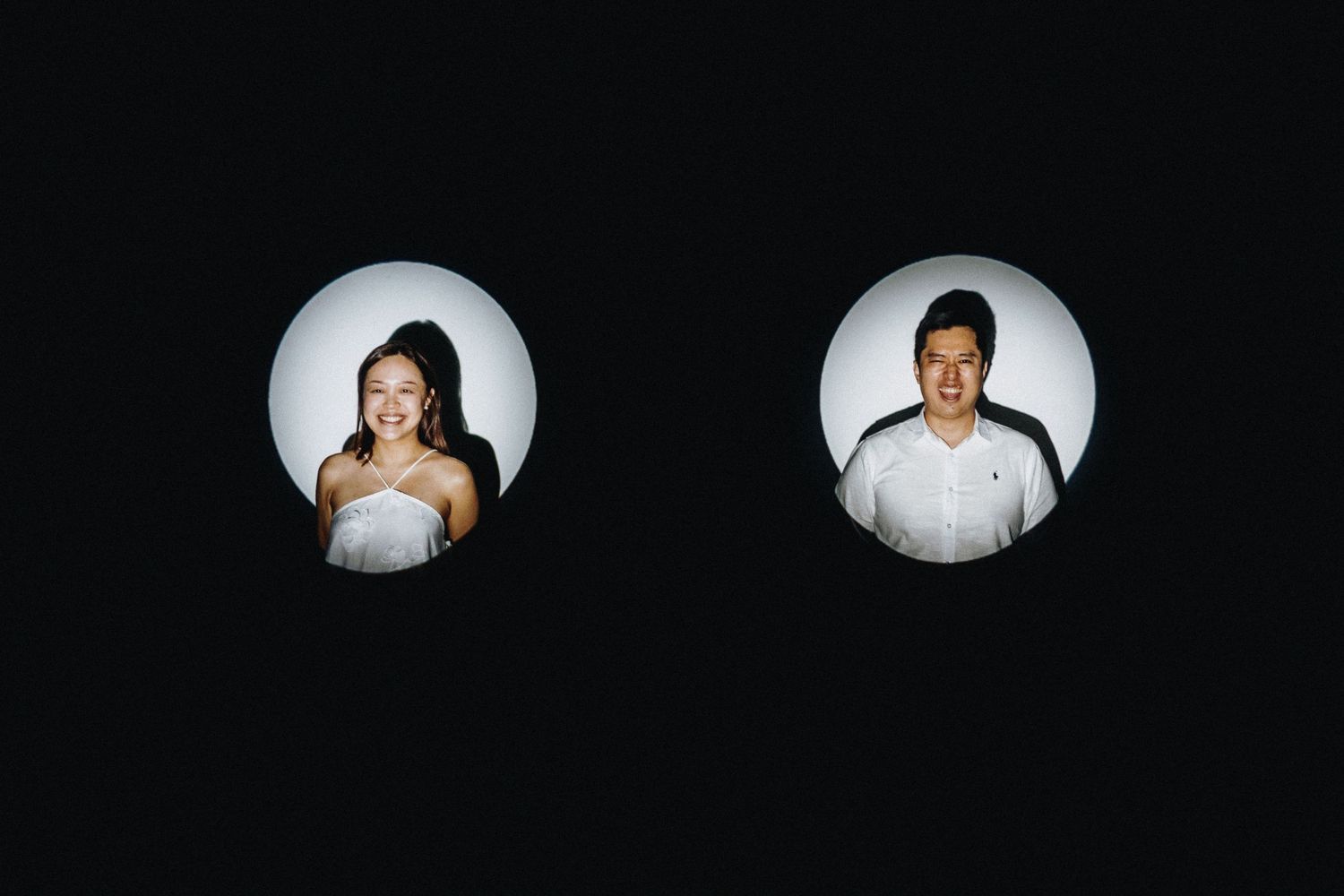 A series of circular black and white portraits arranged in a row showing wedding guests.
