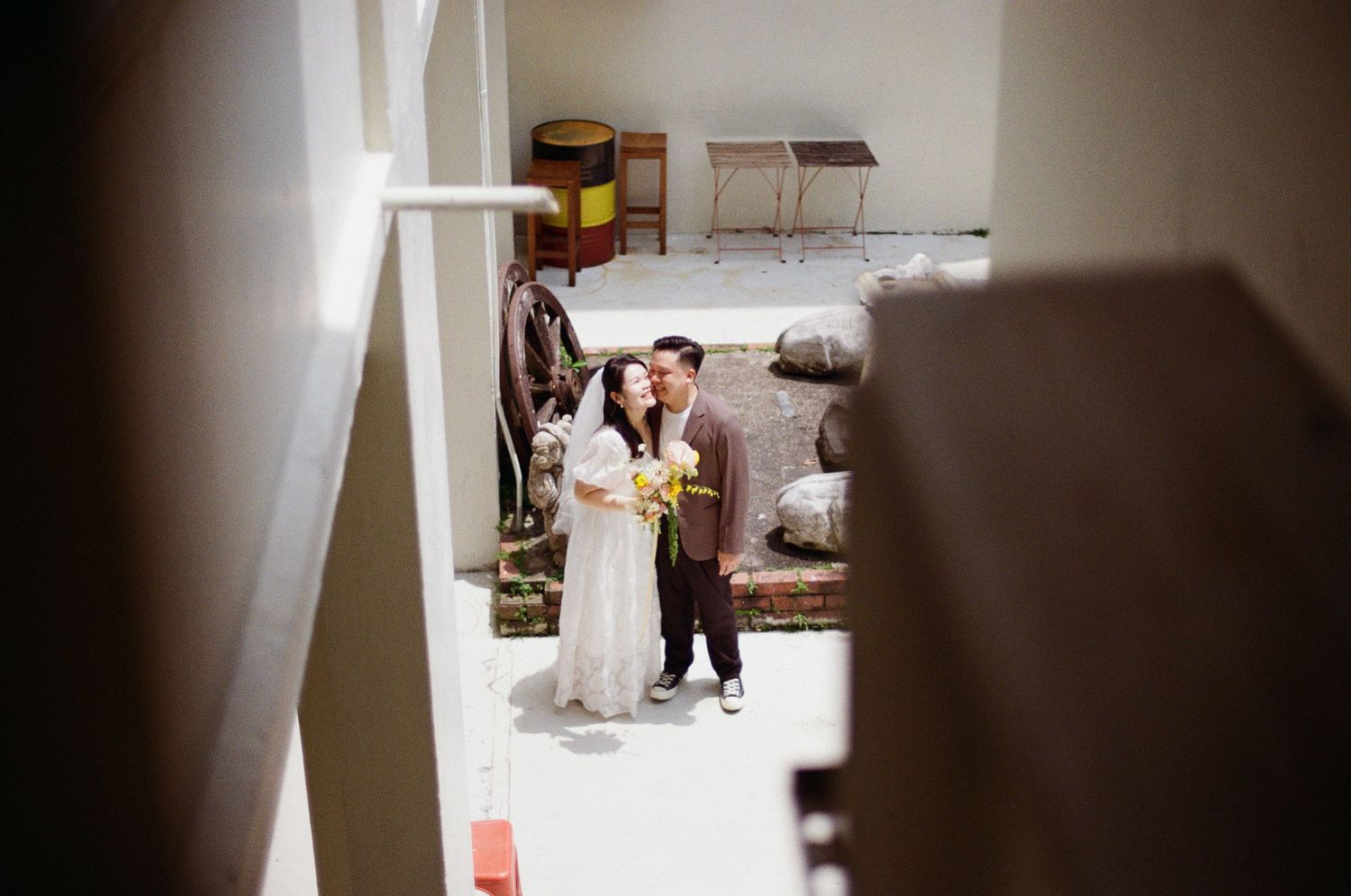 Person in dark clothing moves swiftly through a bright hallway corridor creating a blurred motion effect.