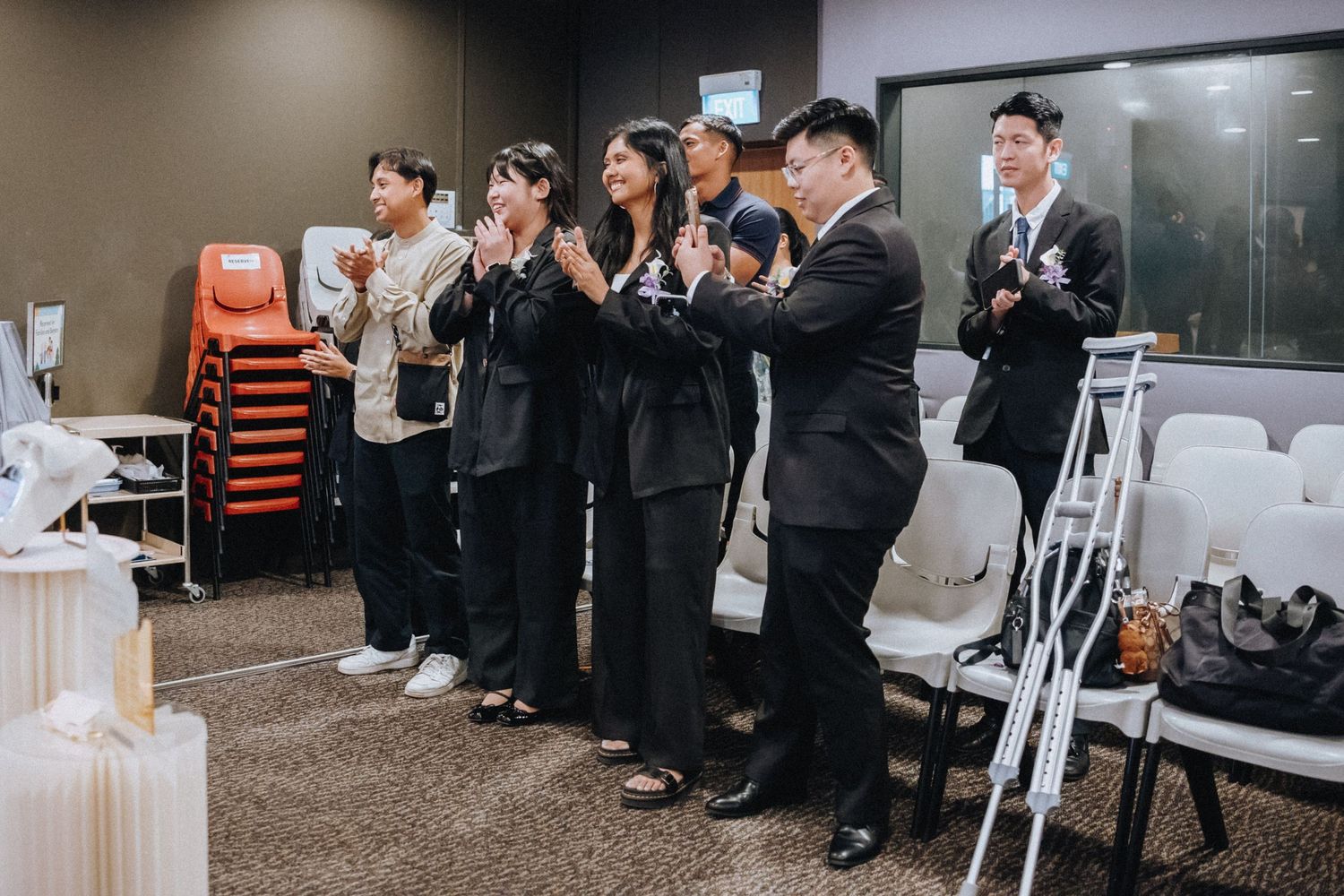 Business professionals seated in rows during a corporate presentation or training event.