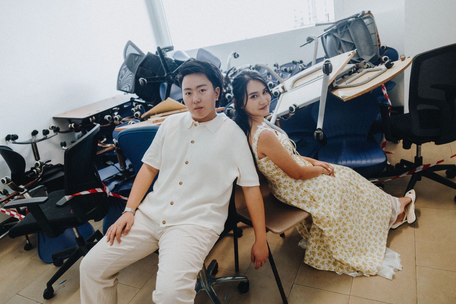 A scene of casual comfort with two people relaxing in a modern studio setting.