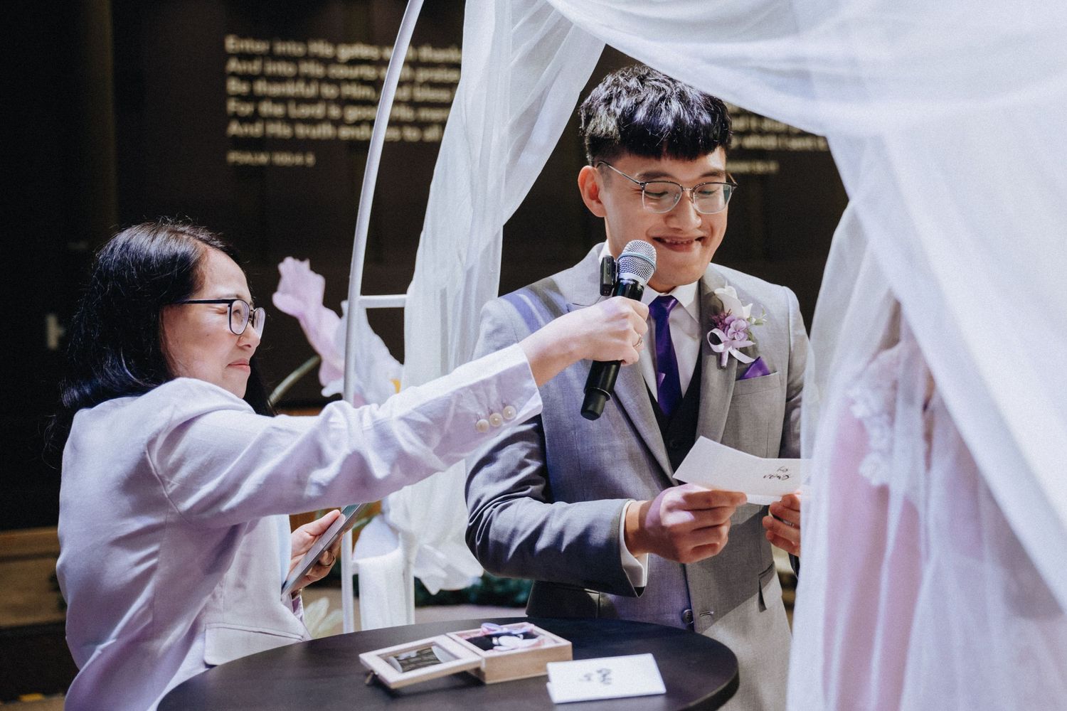 Groomsmen in matching suits participate in wedding day preparations.