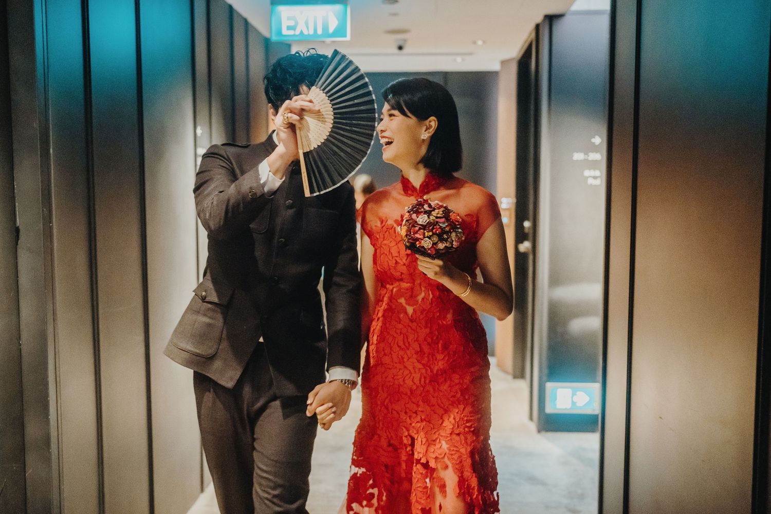 Elegant hallway scene with traditional red dress and modern decor.
