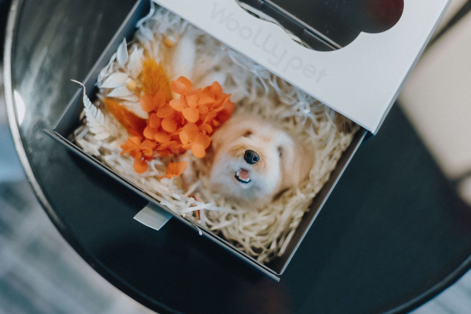 Carrot being grated over a bowl of noodles to create a colorful and fresh garnish.