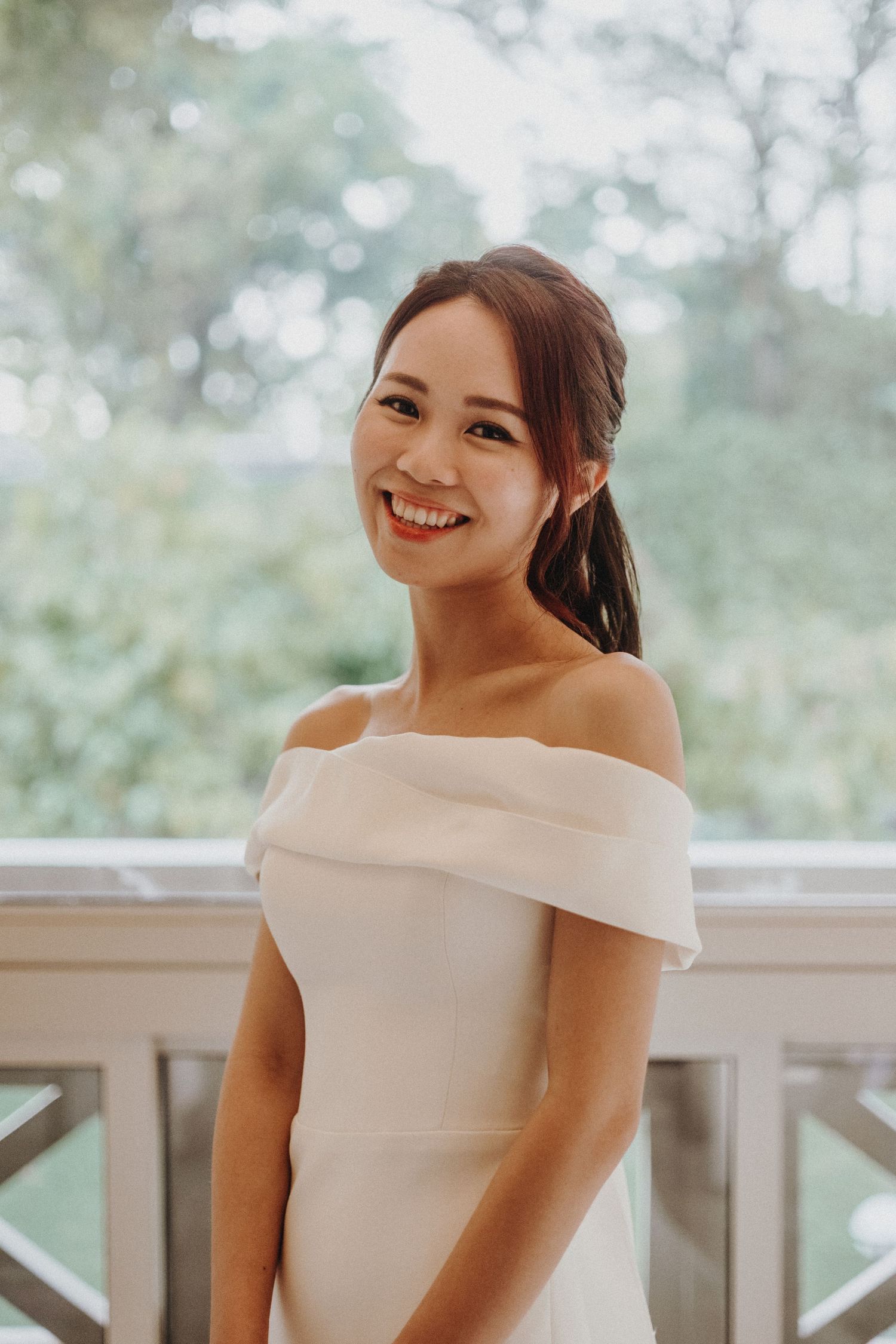 A bride in an off-shoulder white wedding dress shows joyful expressions in a series of portrait photos.