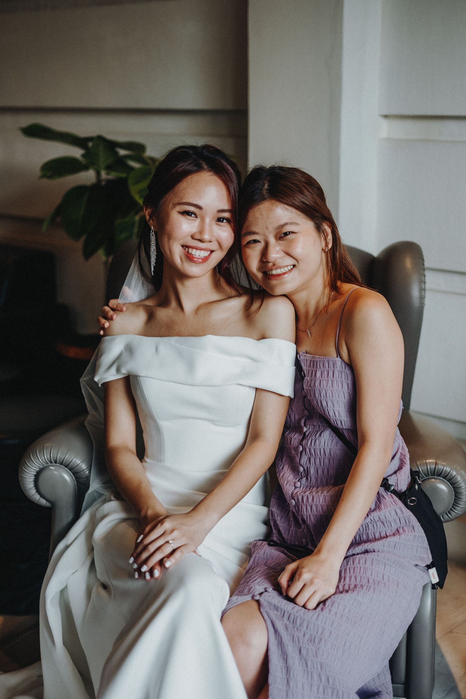 Intimate moment captured during wedding preparations showing close emotional connection.