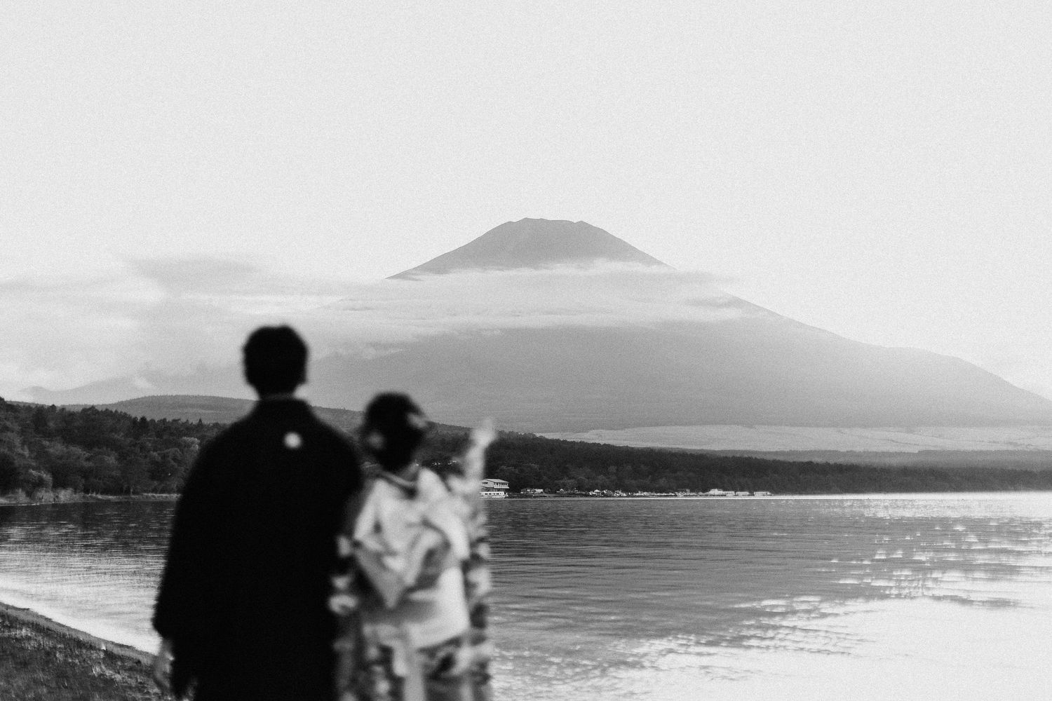 Multiple scenic photos showing a mountain landscape with a volcanic peak in the distance and water in the foreground.