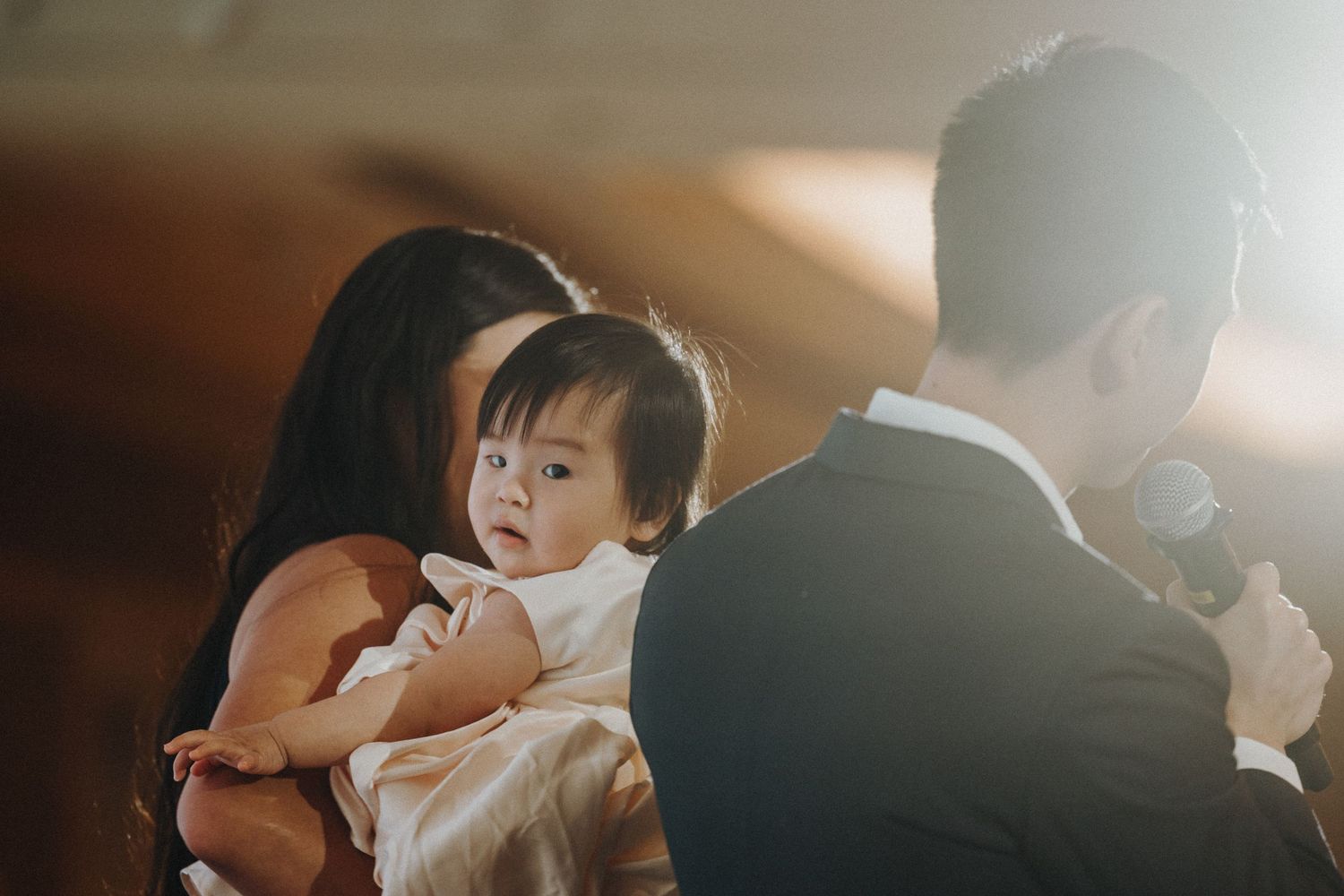 Emotional wedding ceremony moment captured in soft, natural lighting.