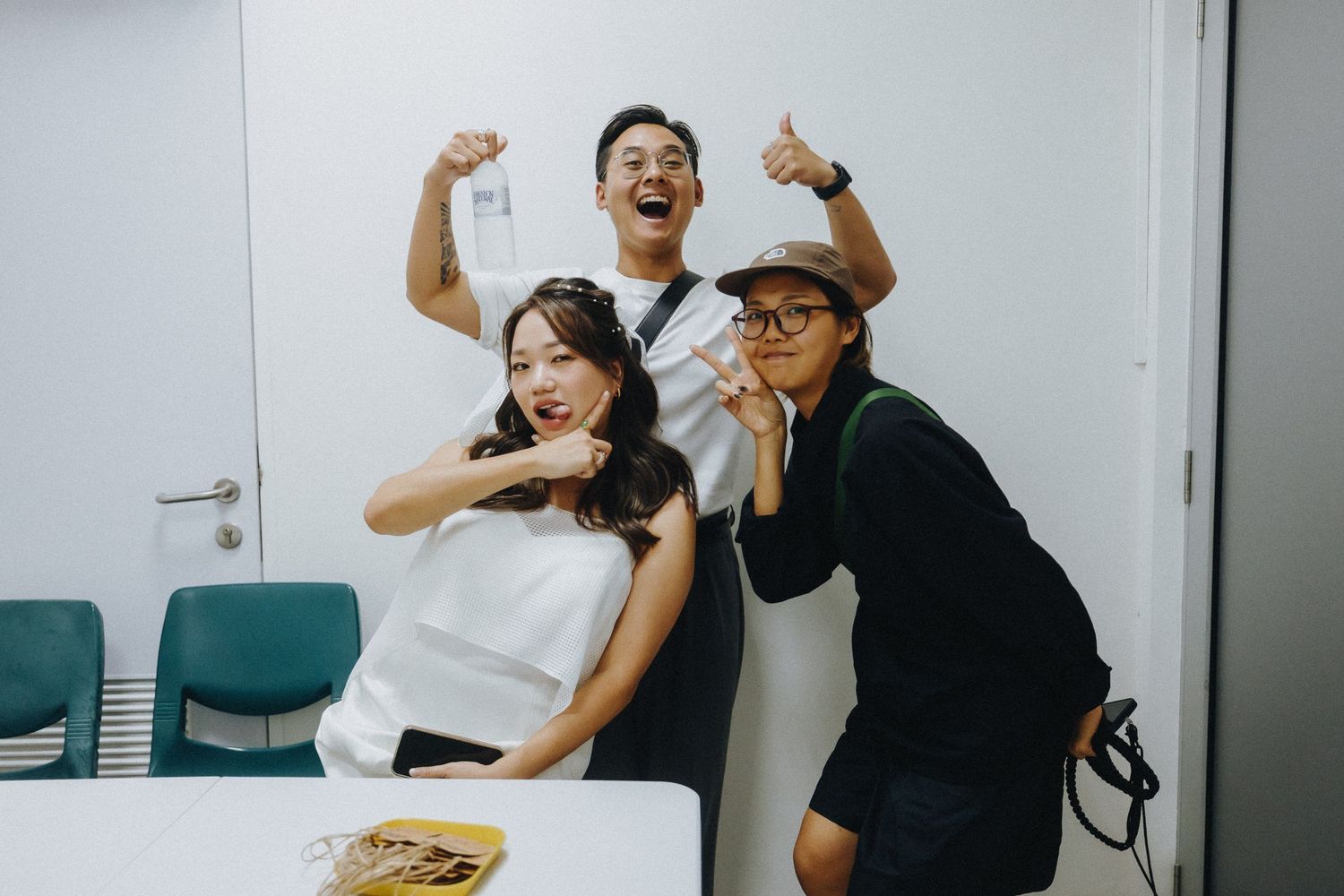 Candid moments of laughter and celebration in a modern office setting.