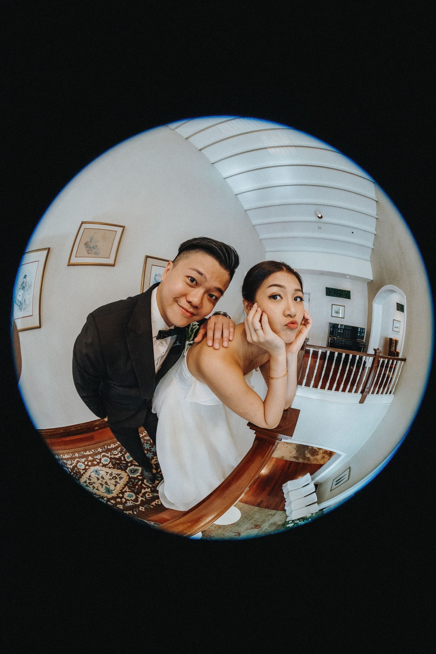 A series of fisheye lens wedding photos capturing playful moments between newlyweds in an indoor setting.