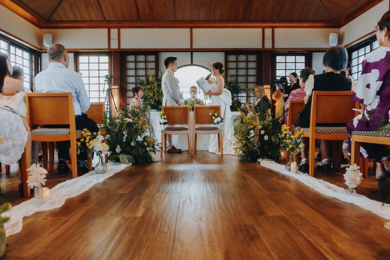 Interior view of Japanese wedding venue with wooden floors and traditional sliding doors.