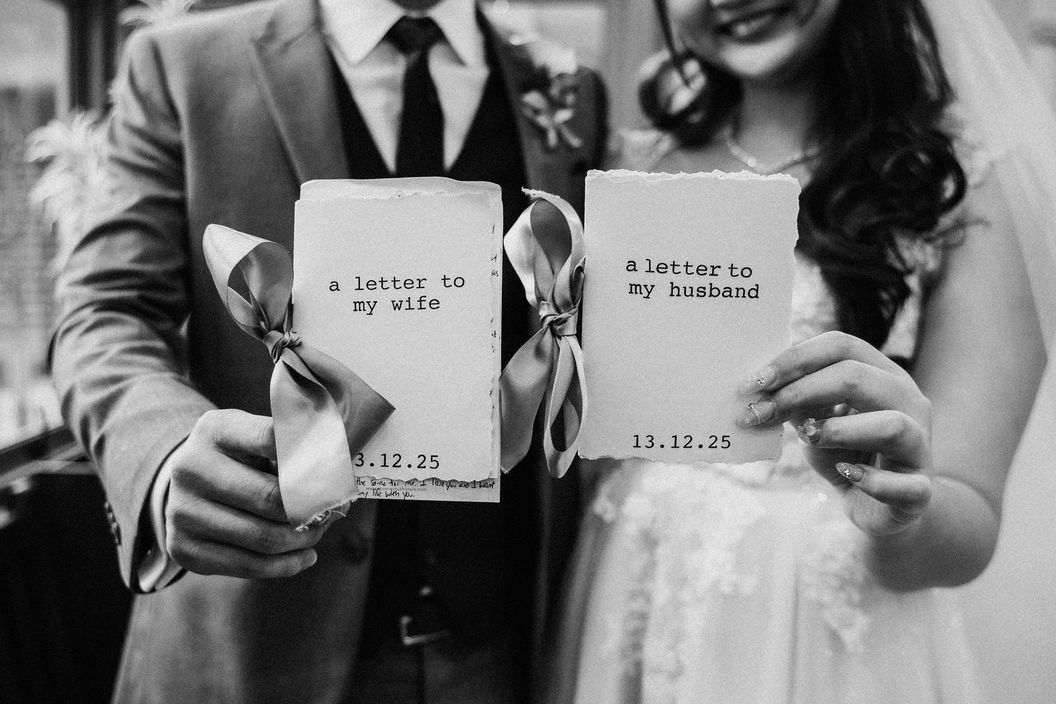 People holding up handwritten notes during a wedding ceremony.