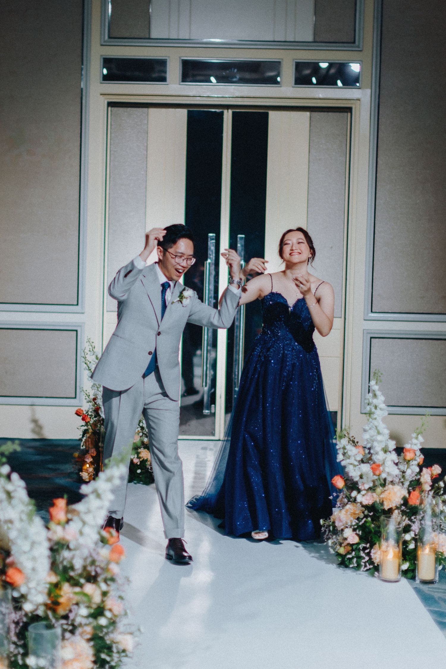 Wedding party sequence showing fun dance moves and celebrations with floral decorations.