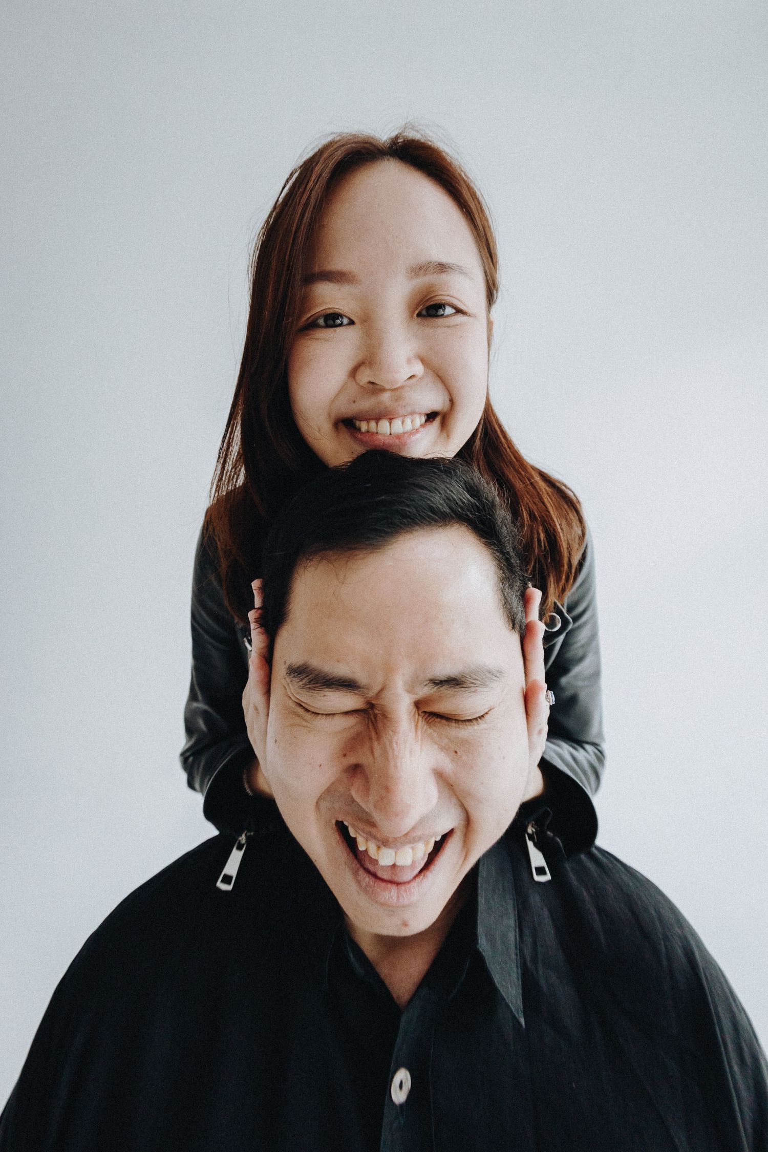 A joyful candid portrait showing expressions of genuine laughter and happiness.