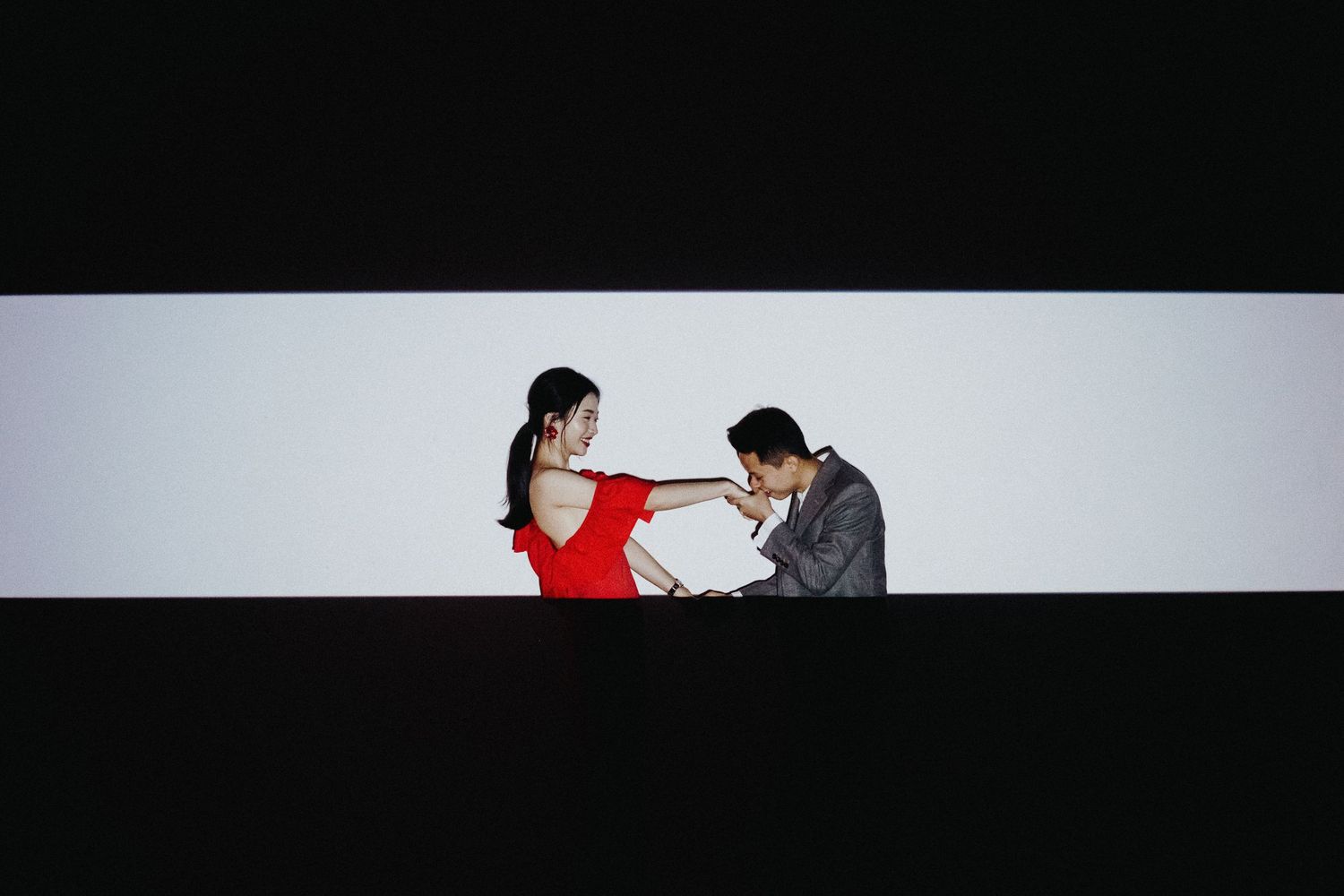 A long horizontal collage strip shows silhouettes of couples in romantic poses against light backgrounds.