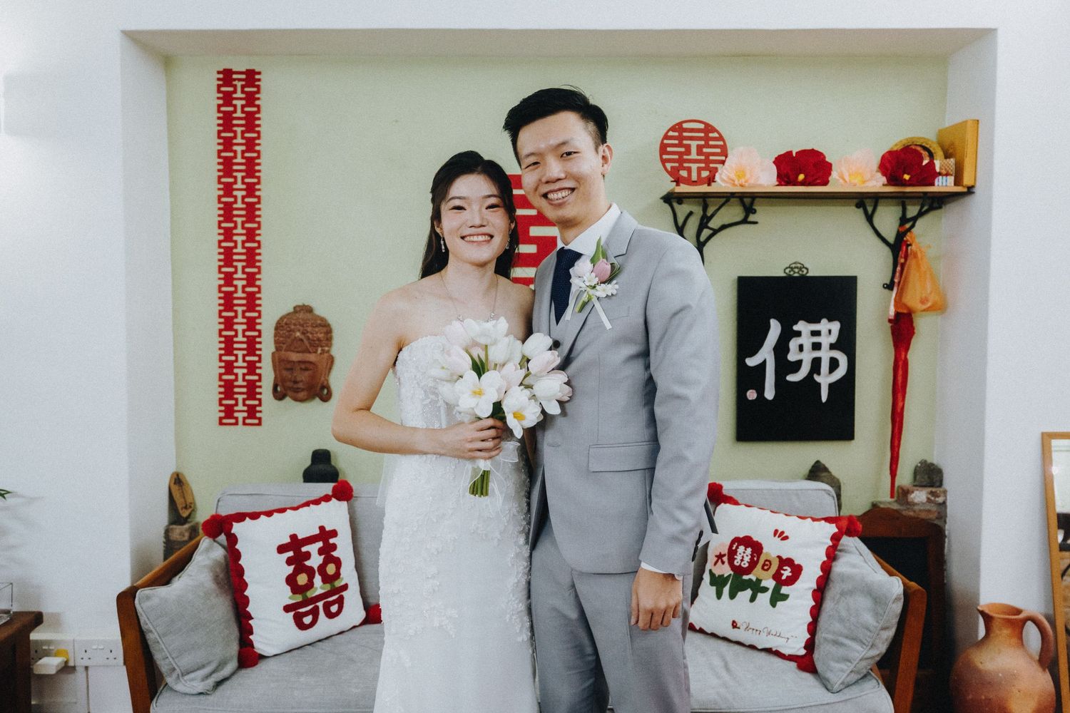 Chinese wedding celebration with traditional double happiness decor and red accents.