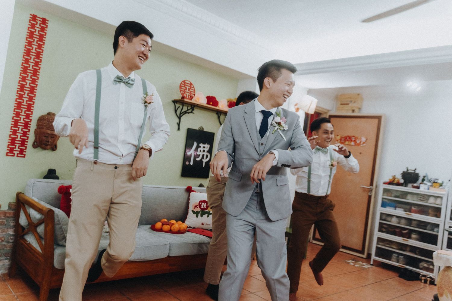 Wedding party celebrating and laughing together in a bright indoor space.