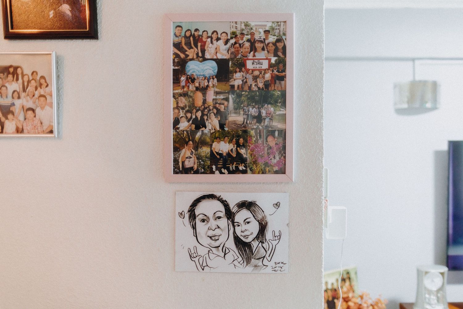 A wall display showing a collage of photos and artwork in a home interior.