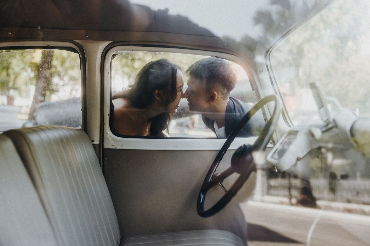 Side view through vintage car window showing classic interior details.