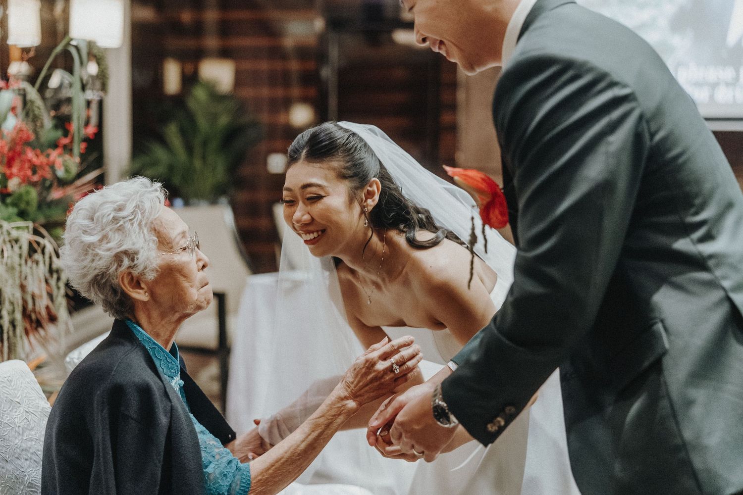 Intimate wedding ceremony moment with couple and guests in formal attire.