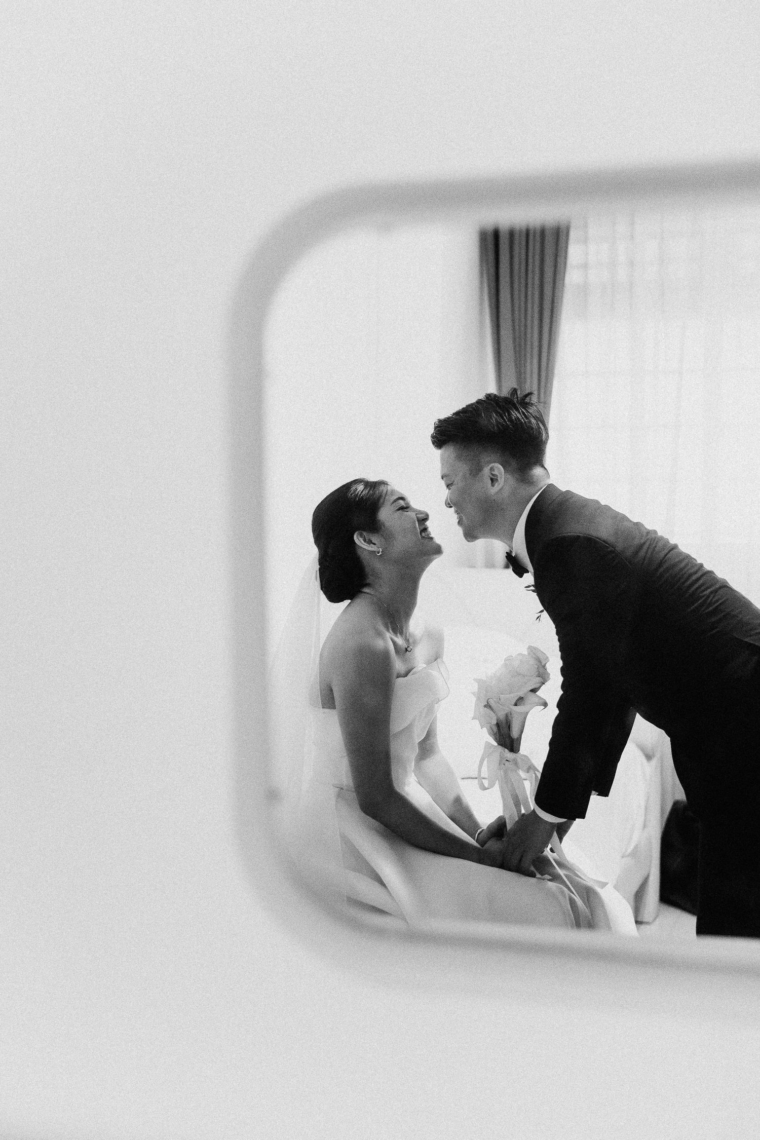 A sequence of romantic black and white photos captured through a window or frame.