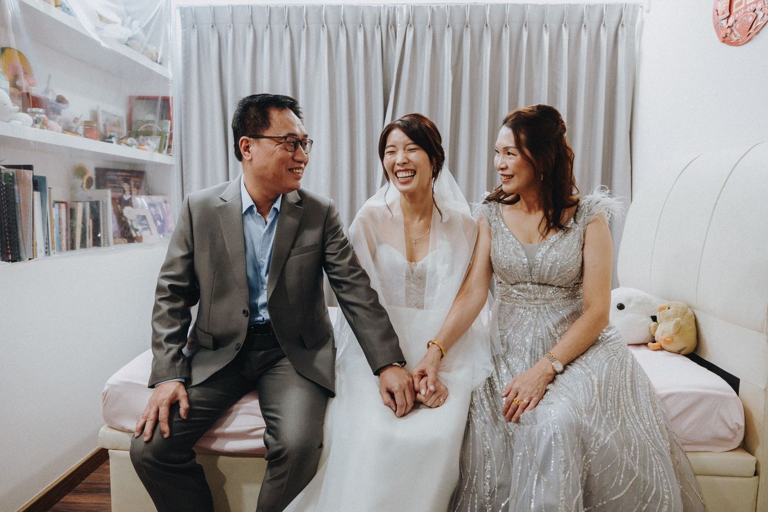 A collection of wedding day moments in a photo strip showing intimate couple interactions and celebration with family.