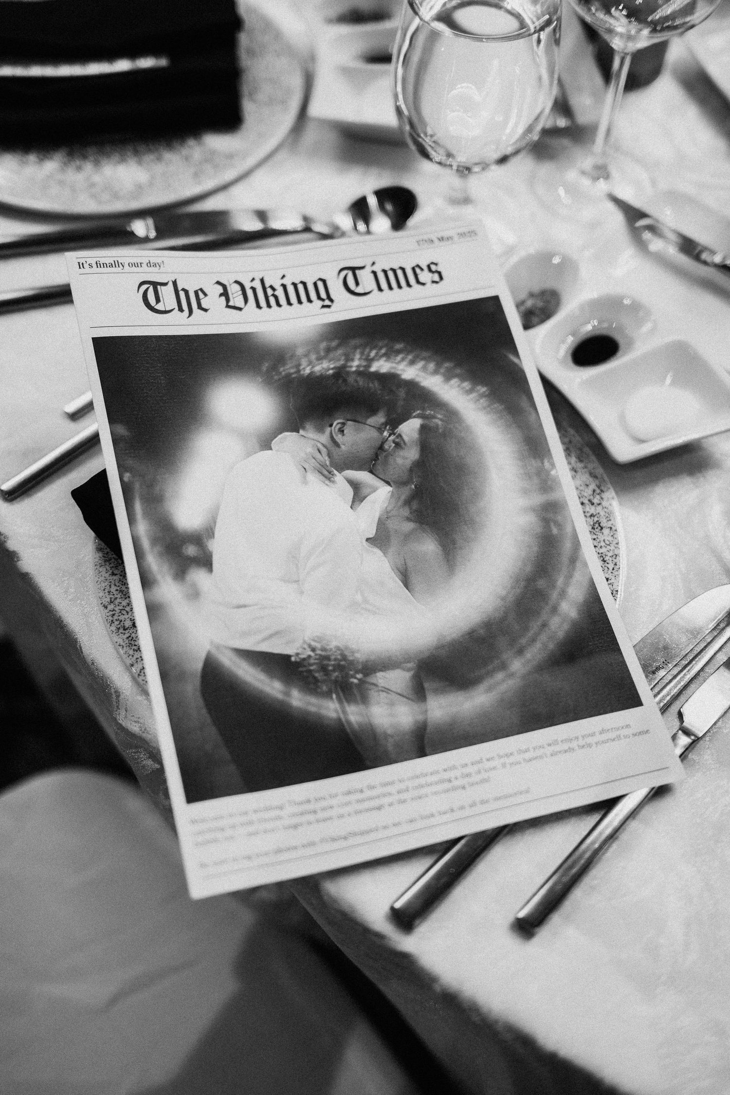 A wedding photo displayed in a creative newspaper style with circular light effect.