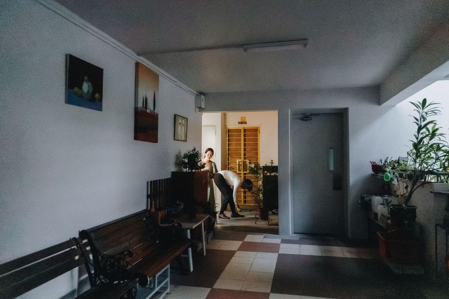 Dark hallway with doorways and minimal decor captured in series of connected interior shots.