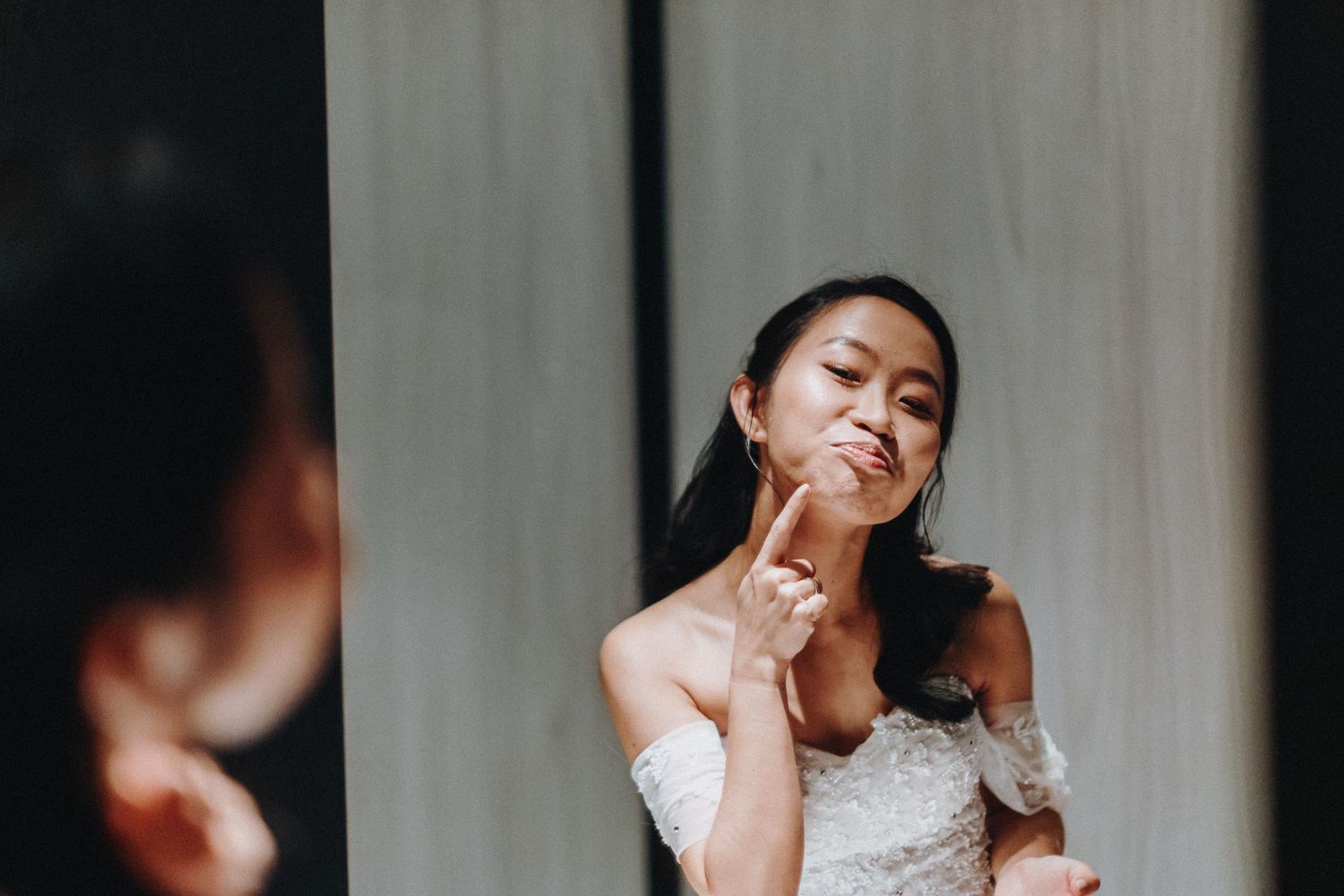 Candid moments captured at wedding reception showing guests and wedding party celebrating.