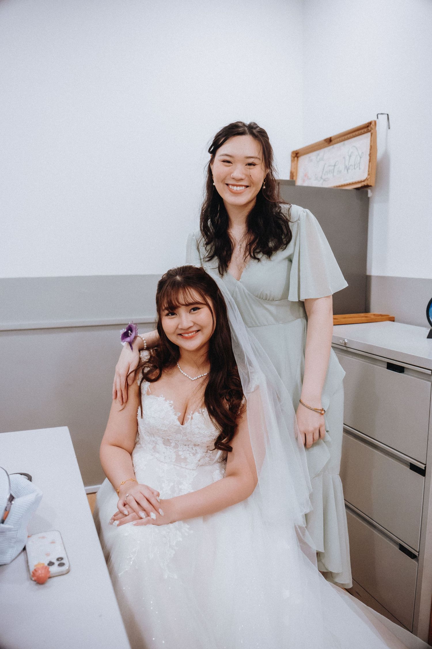 Bridal preparations taking place in a bright, modern dressing room.