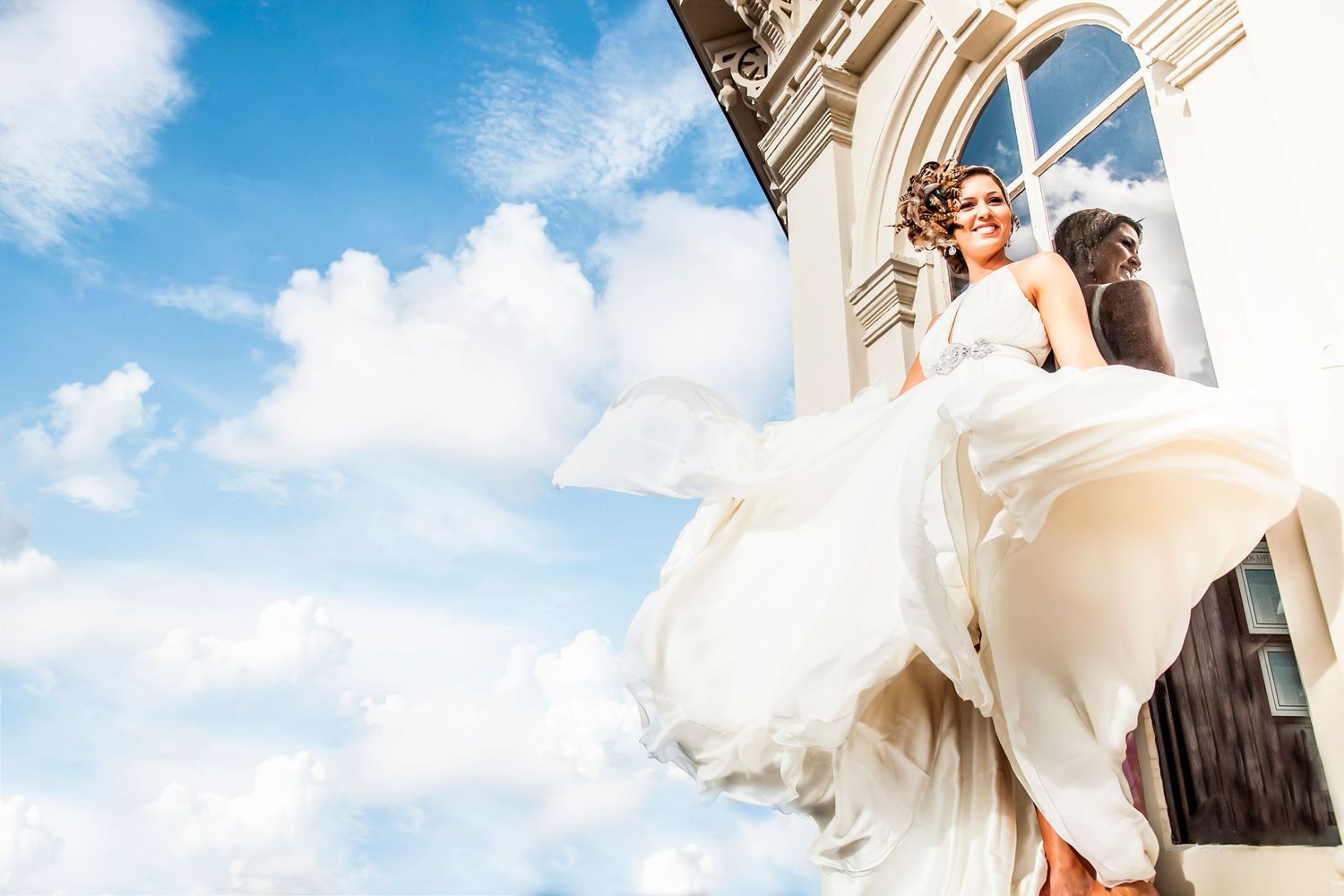 Bride on rooftop Charleston SC. Juliet Elizabeth Photography.