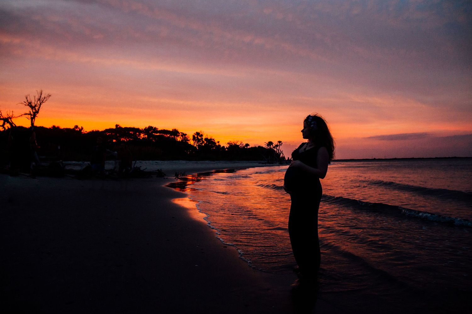 Editorial style maternity portrait on the beach in Folly Beach South Carolina