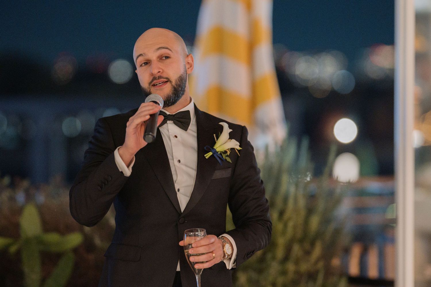 A groom giving a speech at his wedding