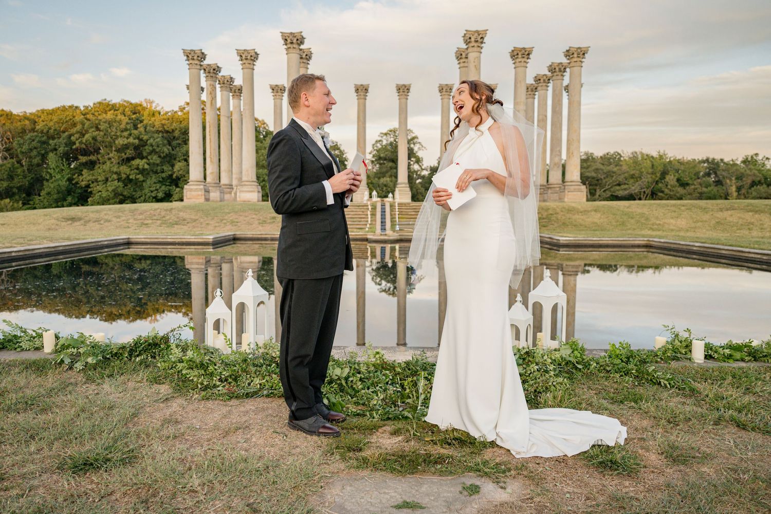 A bride and groom on their wedding day. The image has been edited to remove a microphone stand.