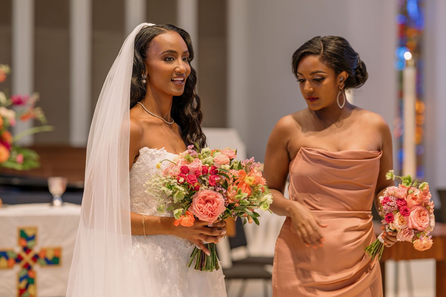 A bride and bridesmaid on her wedding day