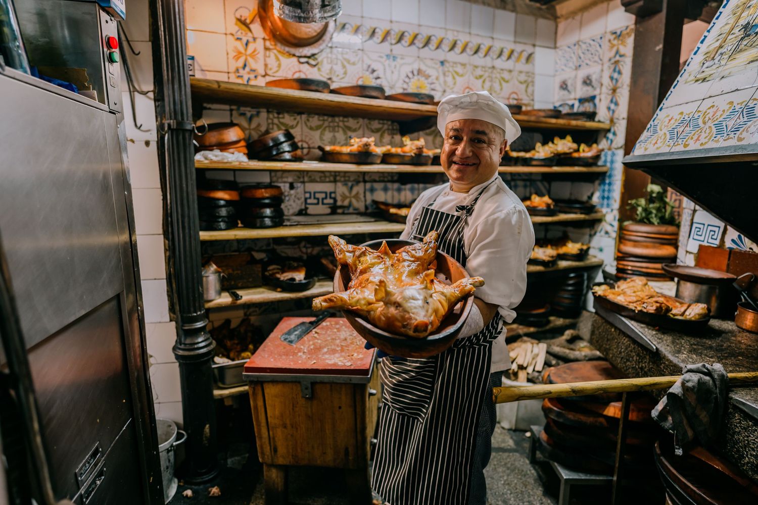 A man roasting a suckling pig in Madrid Spain