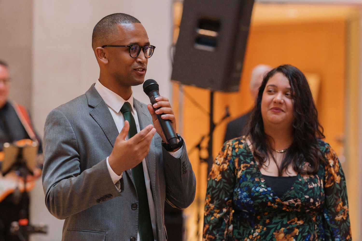 A friend giving a speech at a wedding