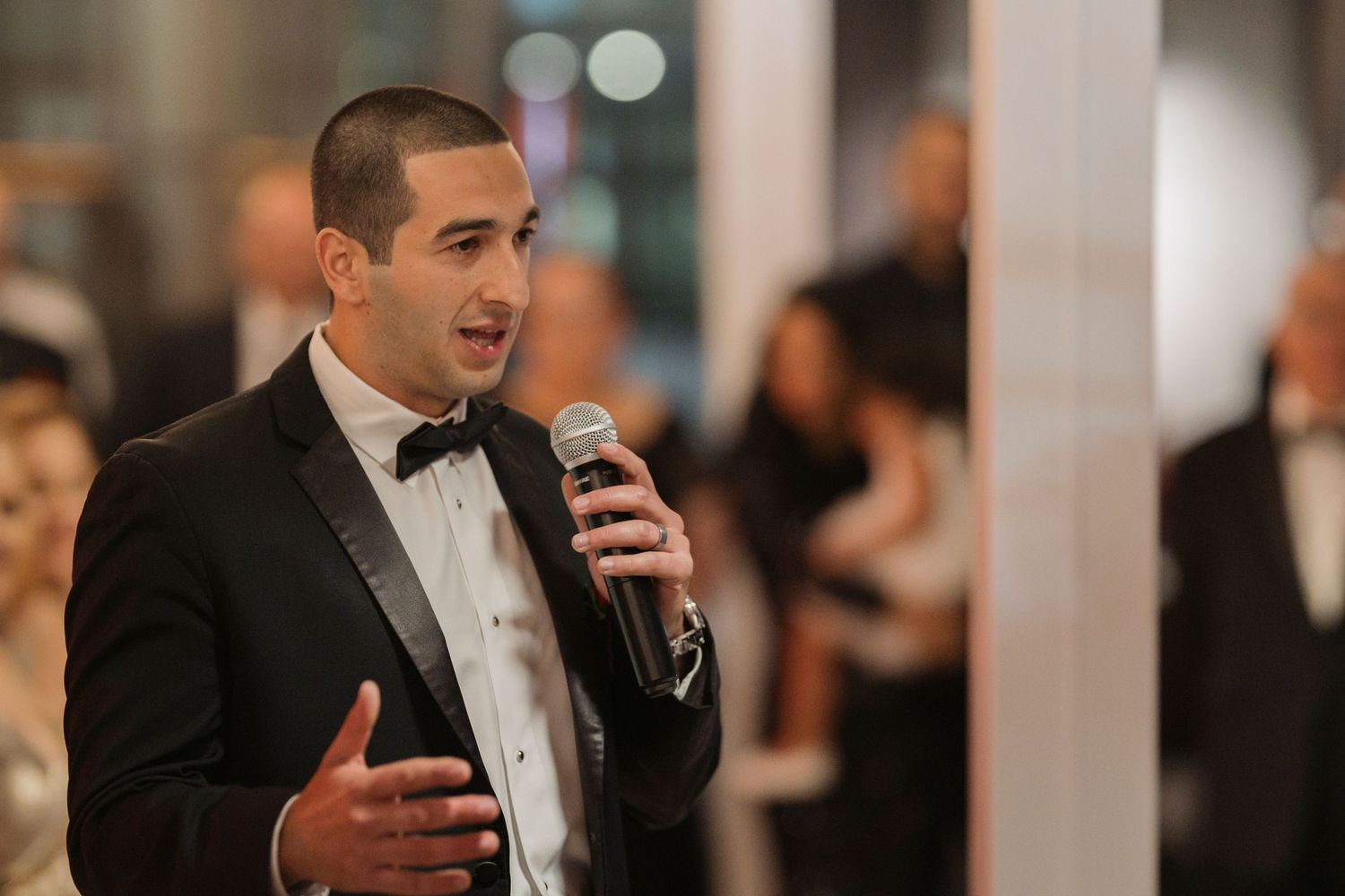 A friend giving a speech at a wedding