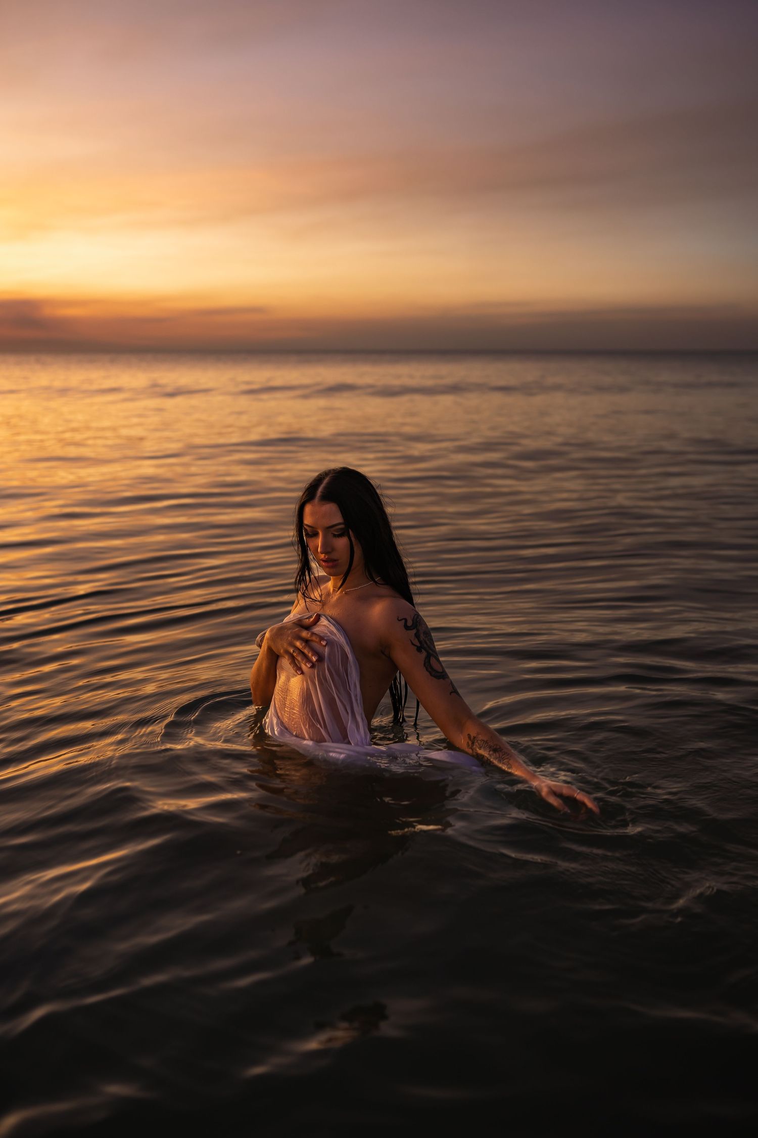 Creative beach portrait photography session at sunset in Darwin captured by Julie Françoise Imagery