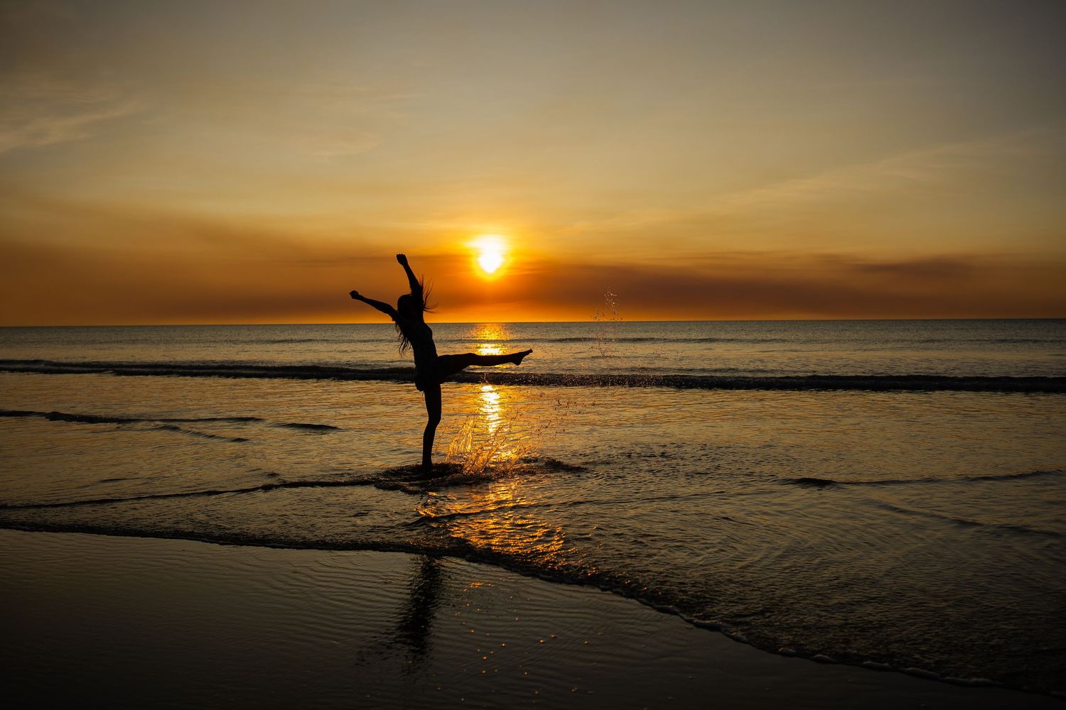 Sunset beach portrait photography session in Darwin featuring golden hour coastal imagery captured by Julie Françoise Imagery
