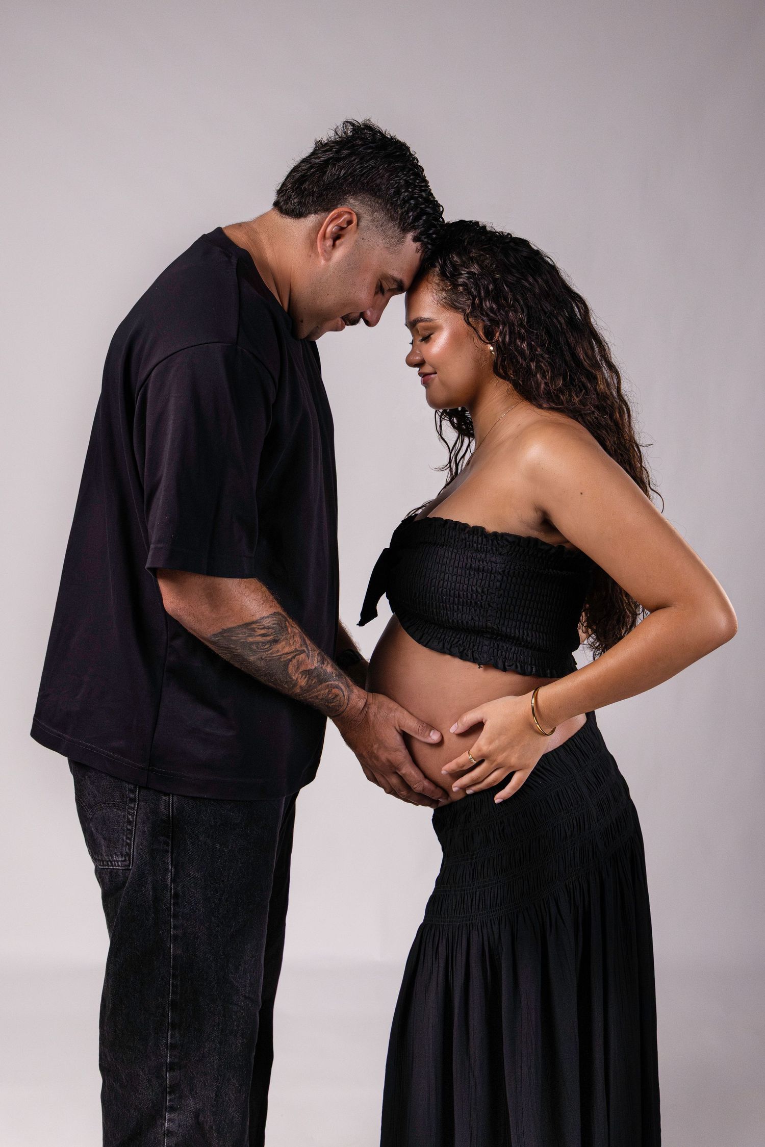 Creative maternity portrait photography session in Darwin studio featuring artistic sunset backdrop captured by Julie Françoise Imagery