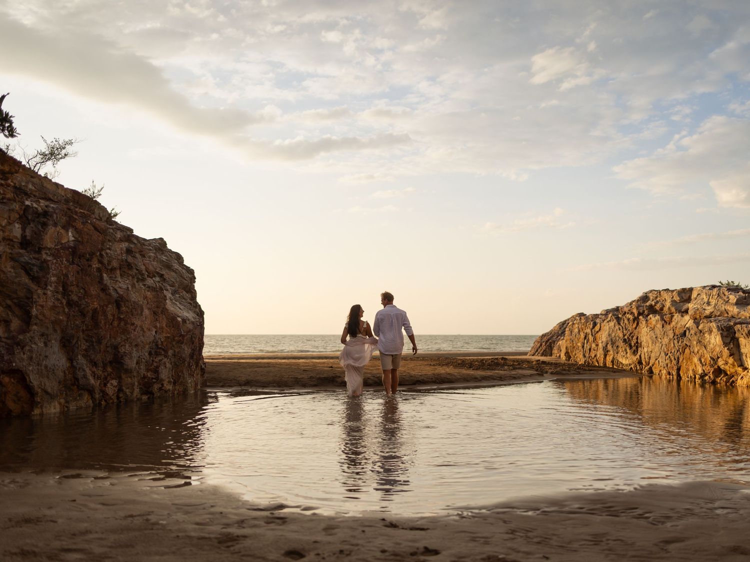 Couples beach photography session in Darwin featuring natural coastal scenery captured by Julie Françoise Imagery