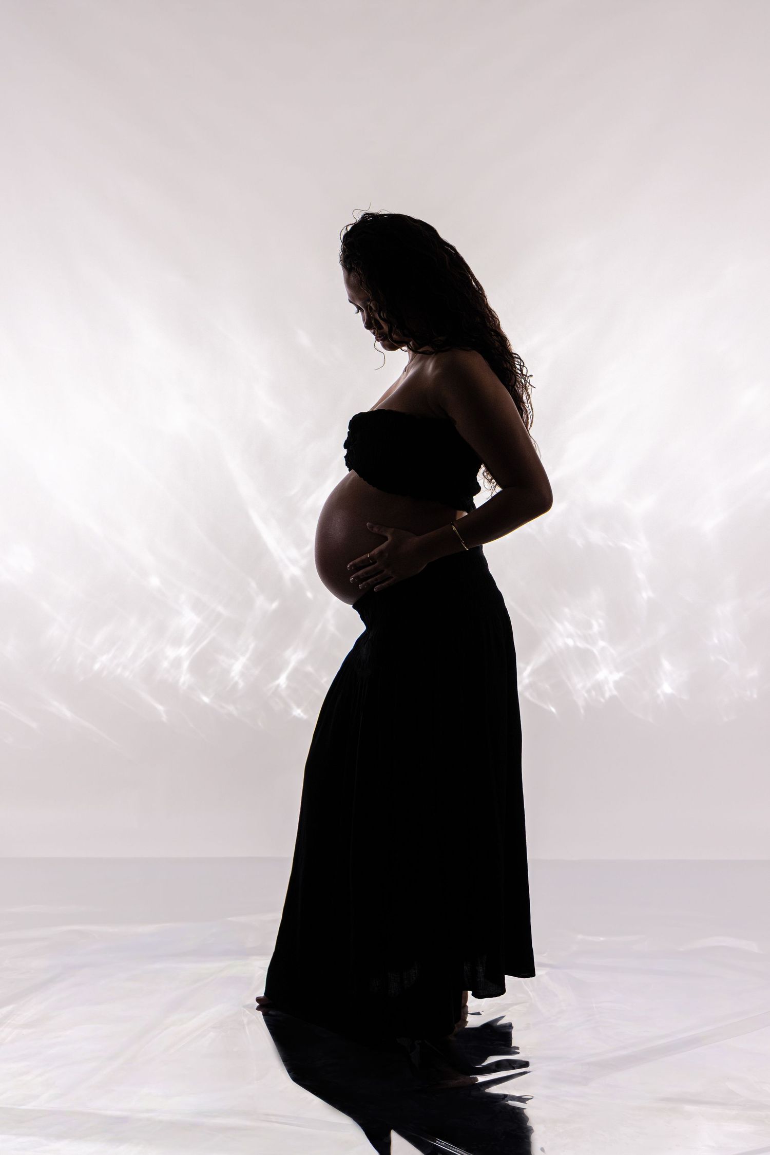 Elegant maternity silhouette portrait photography session in Darwin studio captured by Julie Françoise Imagery