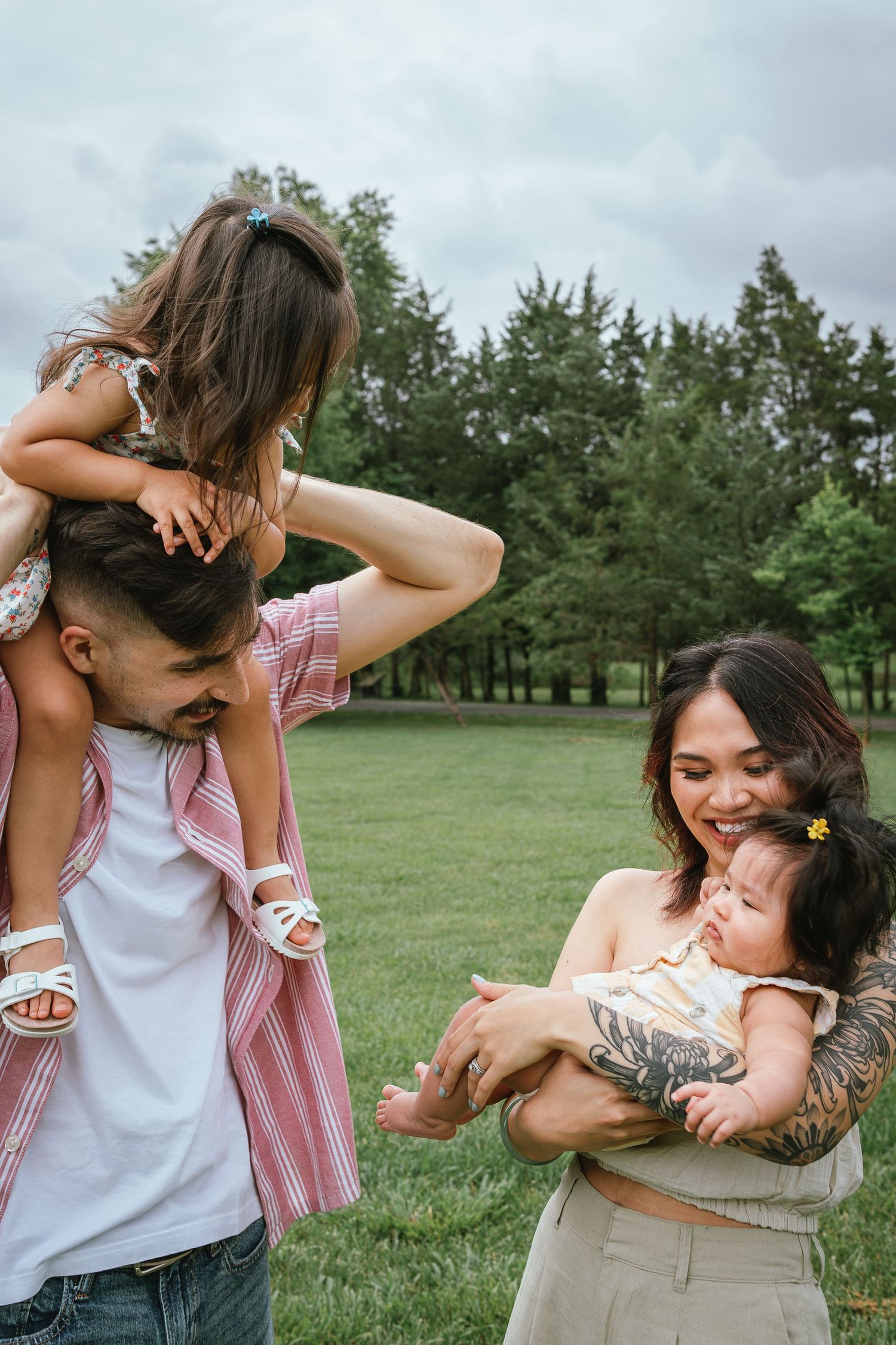 A joyful family interaction captured outdoors on a summer day.