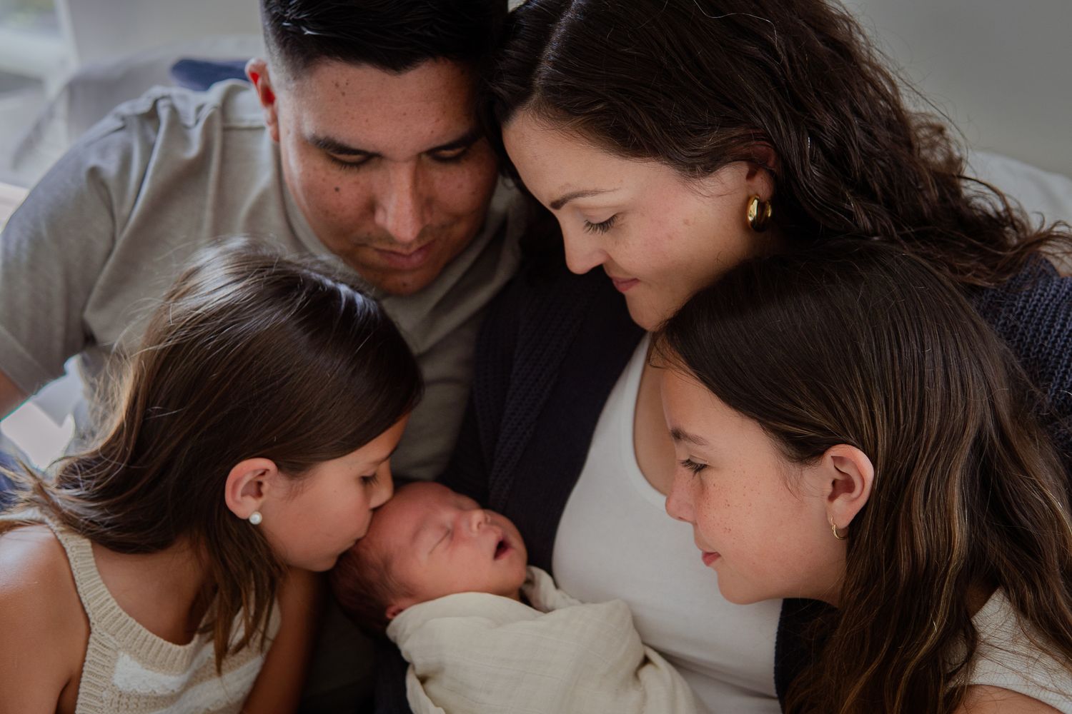 Intimate family photo showing tender moments and closeness.