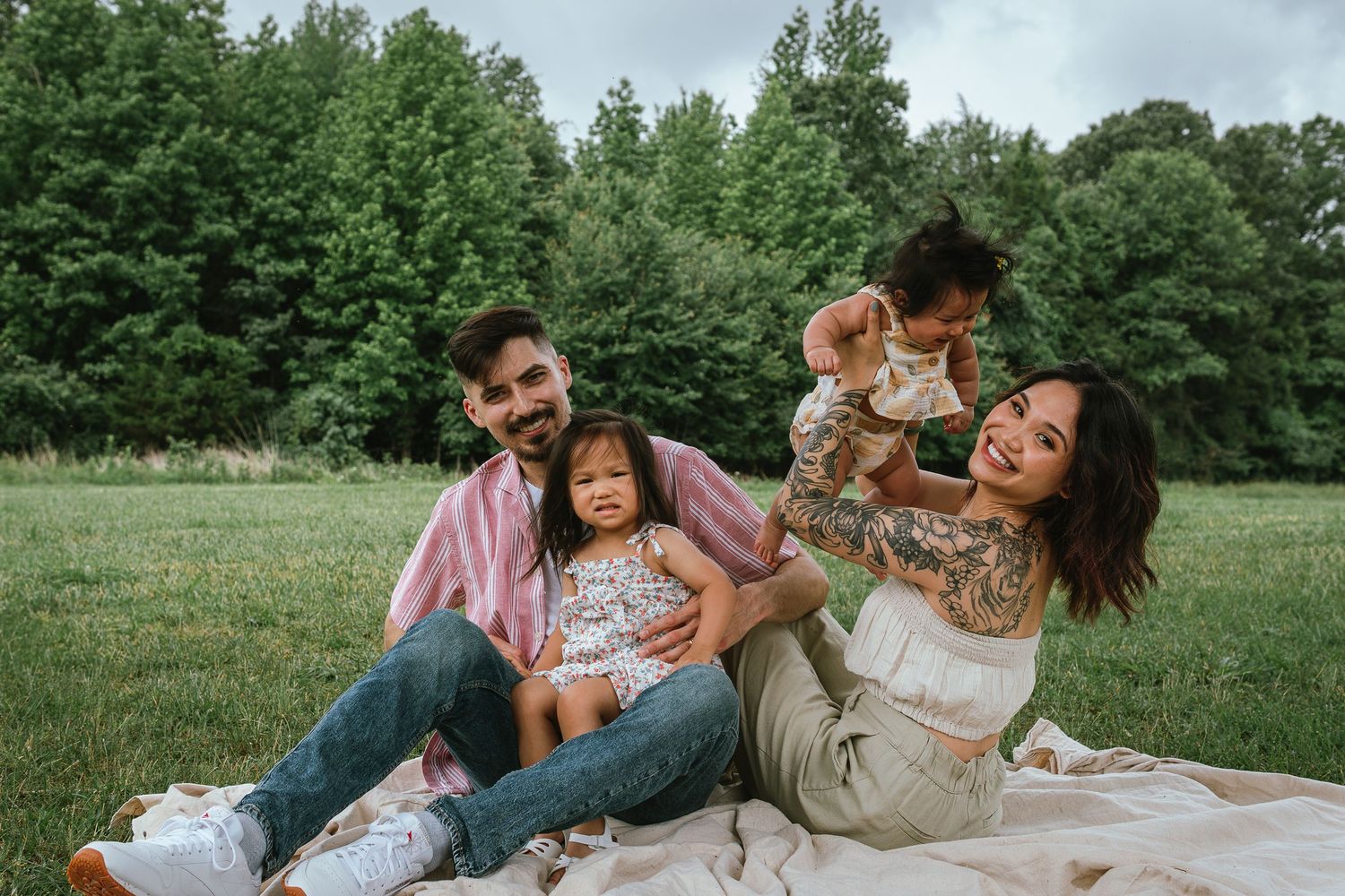 Playful family moments captured in a series of candid photographs on grass with trees in background.
