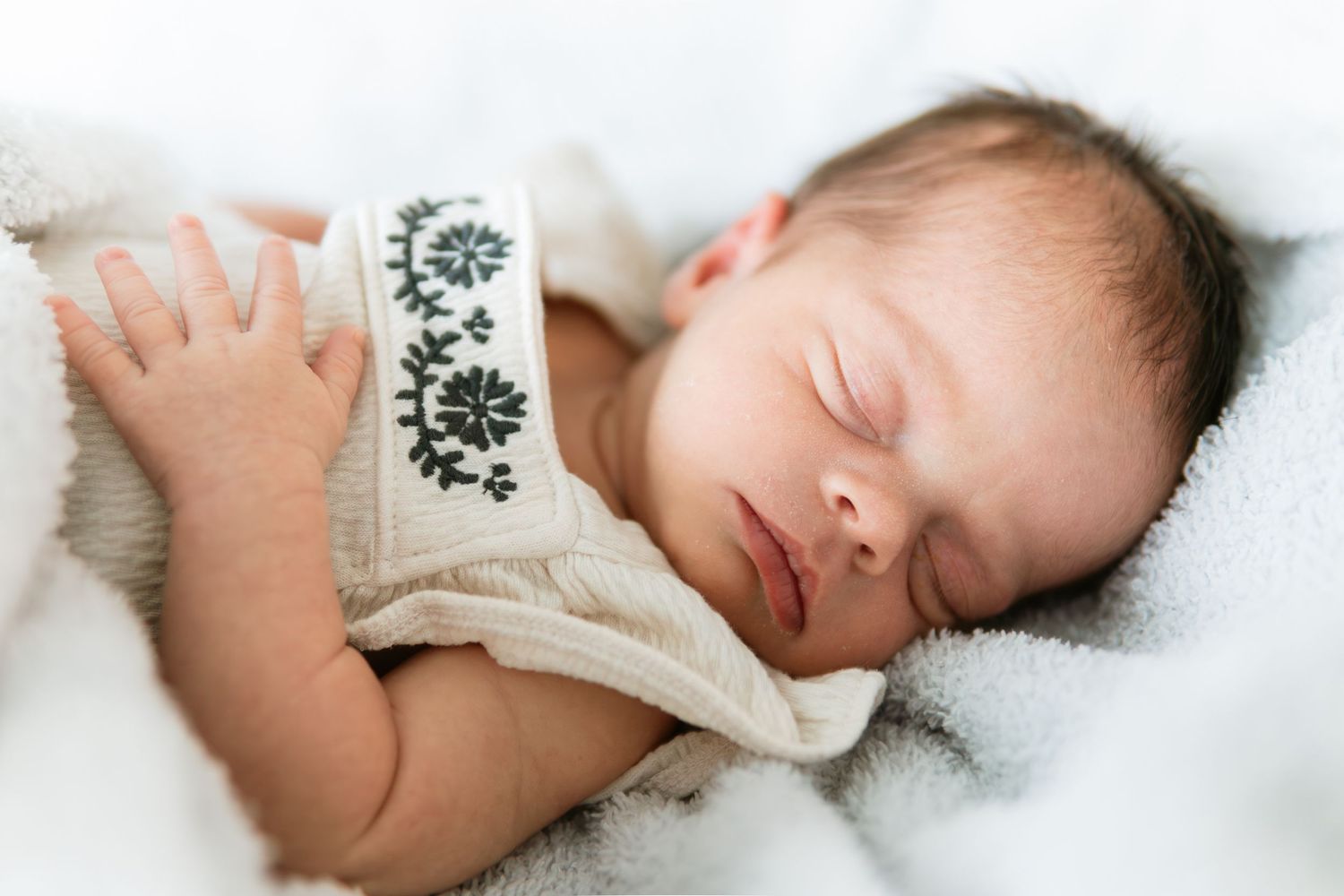 A sequence of peaceful sleeping photos on white sheets showing restful slumber in soft light.