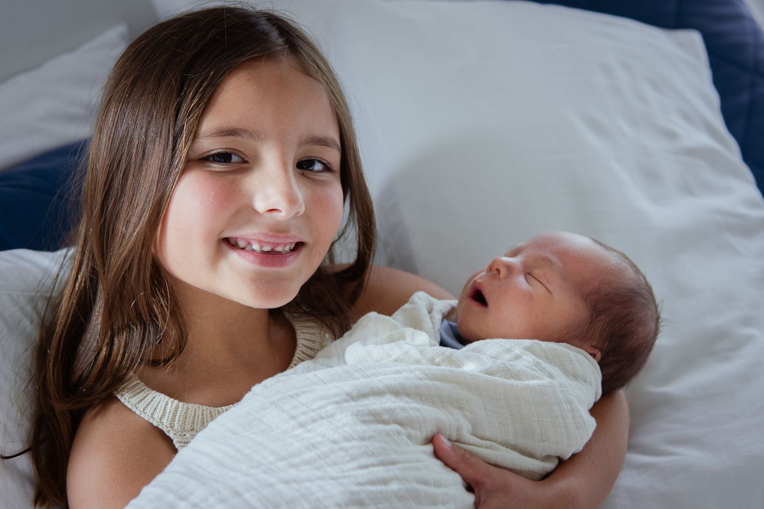 Heartwarming moments of siblings meeting their new baby family member.