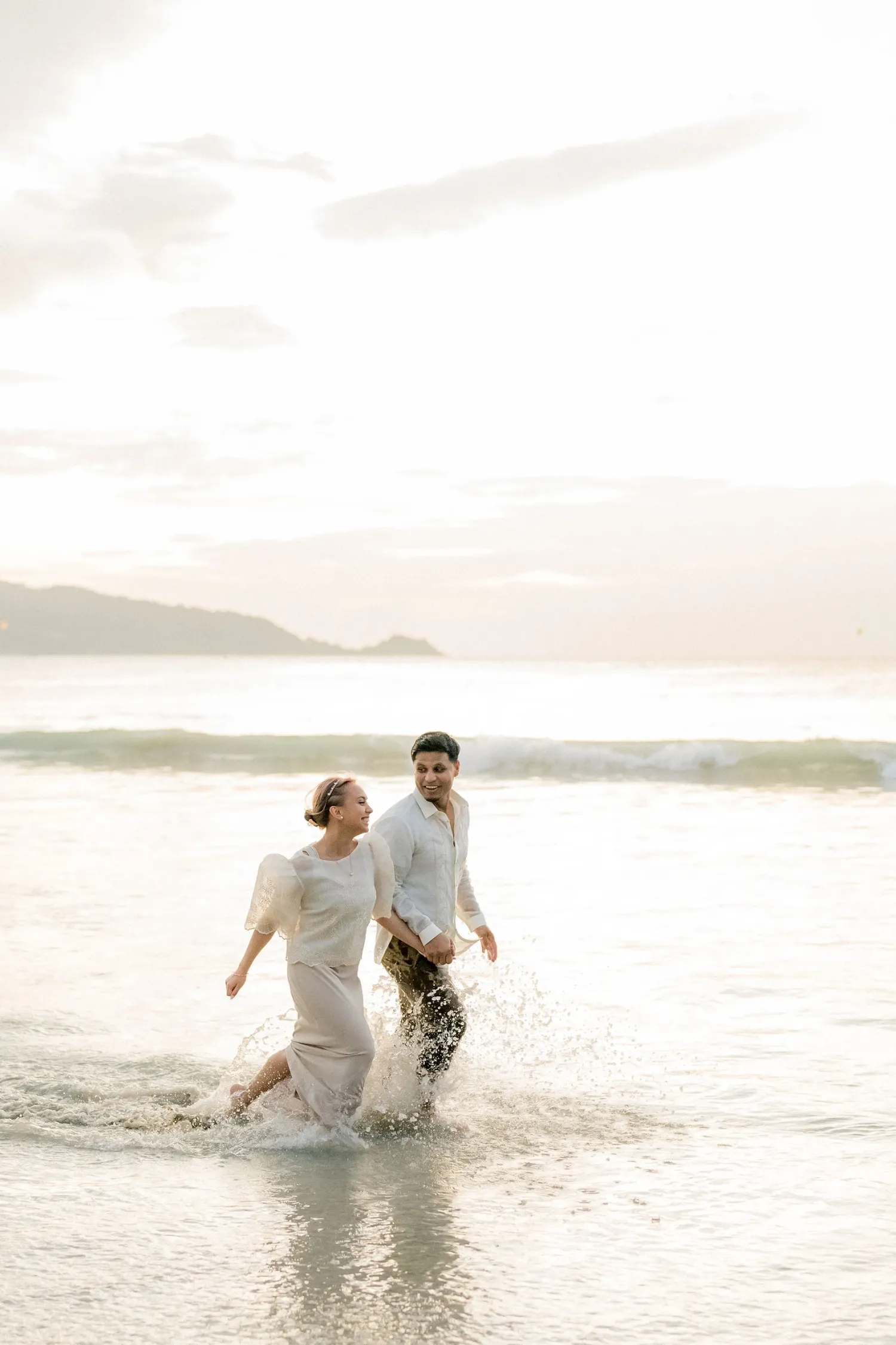 Honeymoon photography at Patong beach Phuket, Thailand during sunset time the both so happy in this said magic moments, Patong photographer