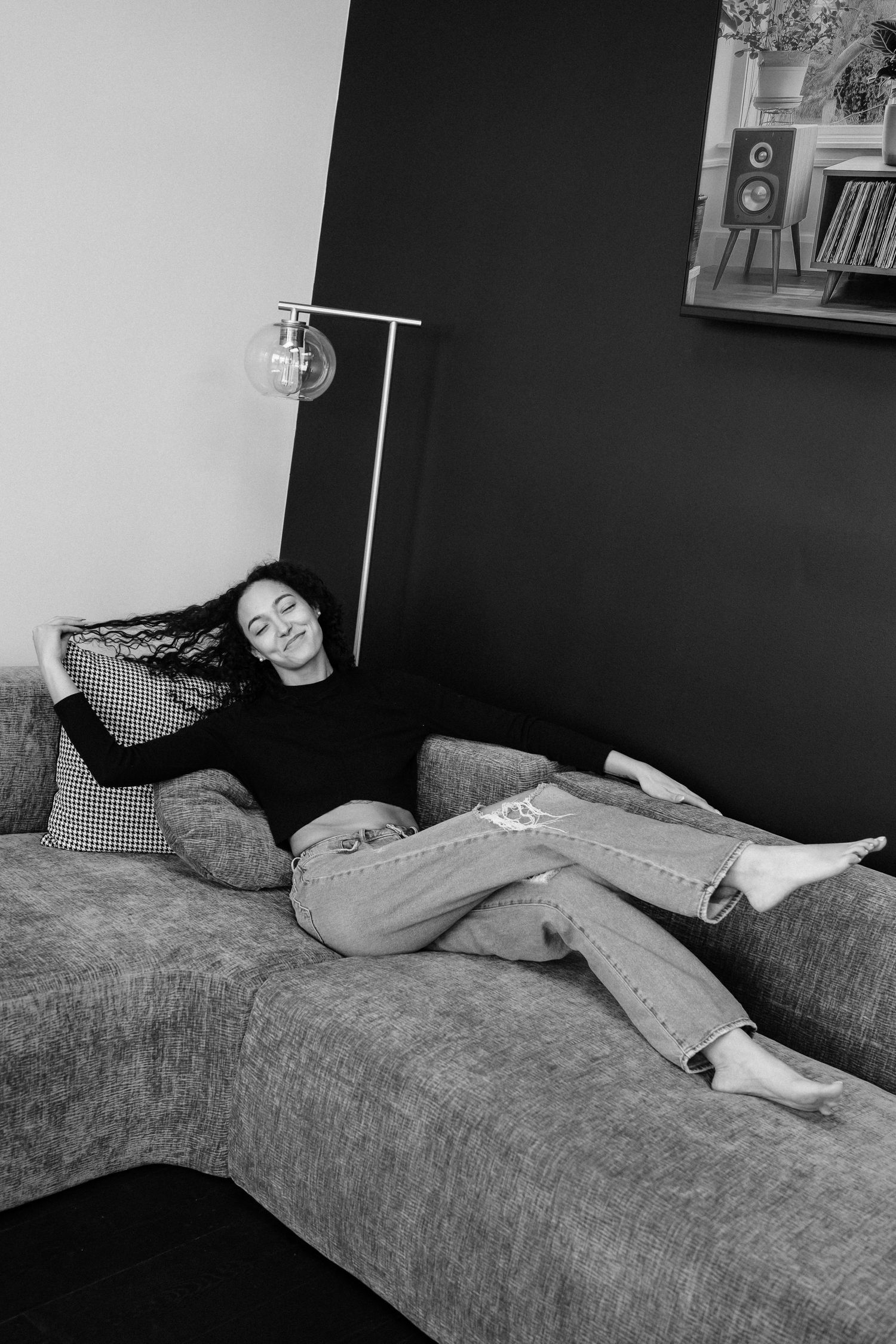 A sequence of black and white photos showing someone sleeping on a couch with study materials nearby.